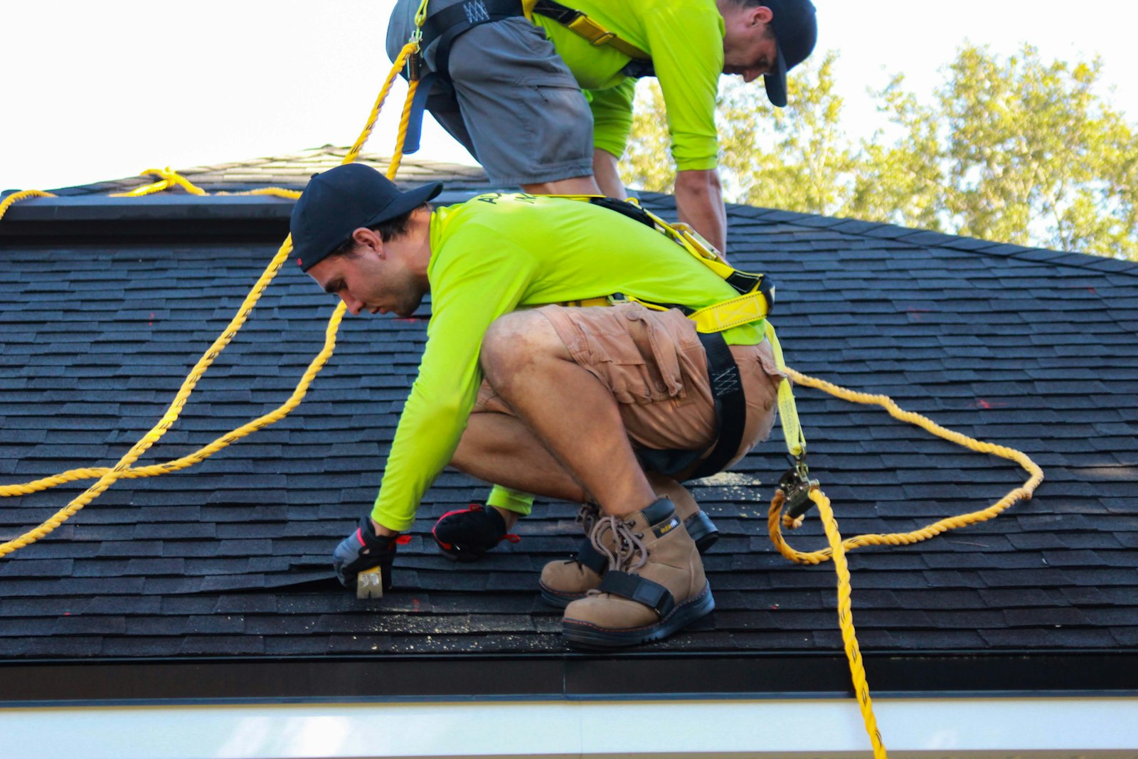 Quick Roofers crew working on a residential roof