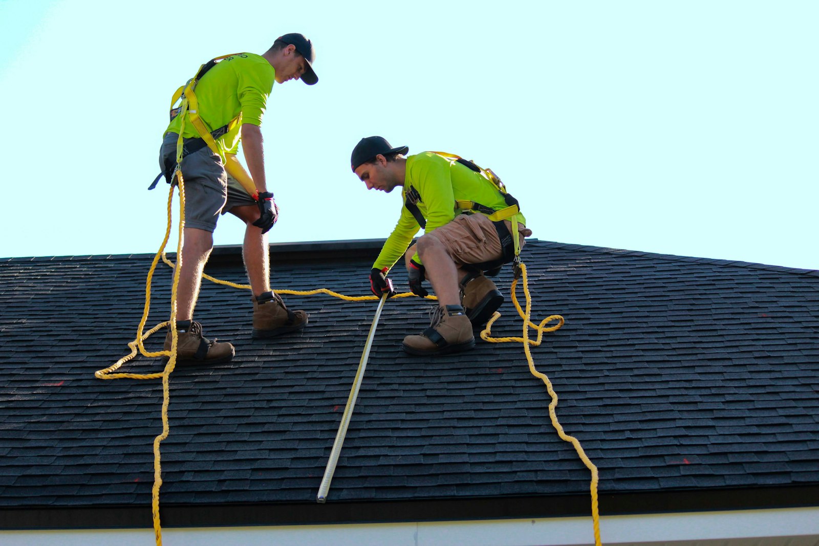Storm response crew assessing residential roof damage